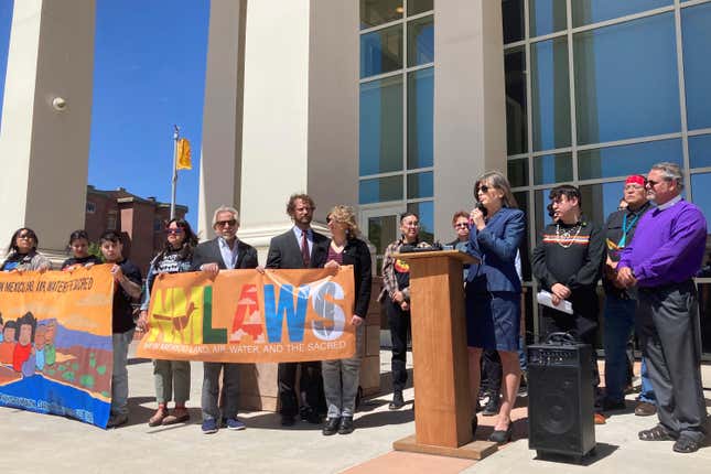 FILE - Attorney Gail Evans, of the Center for Biological Diversity&#39;s Climate Law Institute, speaks about pollution from oil and natural gas development and frustration with state oversight of the industry outside the state First District Court in Santa Fe, N.M., on Wednesday, May 10, 2023. A bill to ban oil and gas production within a mile (1.6 kilometers) of schools and daycare centers across New Mexico is among the first published proposals as the state legislature prepares for a 30-day session that could bring an overhaul to fundamental oil and gas regulations, Wednesday, Jan. 3, 2024. (AP Photo/Morgan Lee, File)