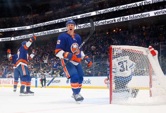 ELMONT, NEW YORK - MARCH 23: Kyle MacLean #32 of the New York Islanders reacts to a first period goal by Cal Clutterbuck #15 of the New York Islanders against Connor Hellebuyck #37 of the Winnipeg Jets at UBS Arena on March 23, 2024 in Elmont, New York. The Islanders defeated the Jets 6-3. (Photo by Bruce Bennett/Getty Images)