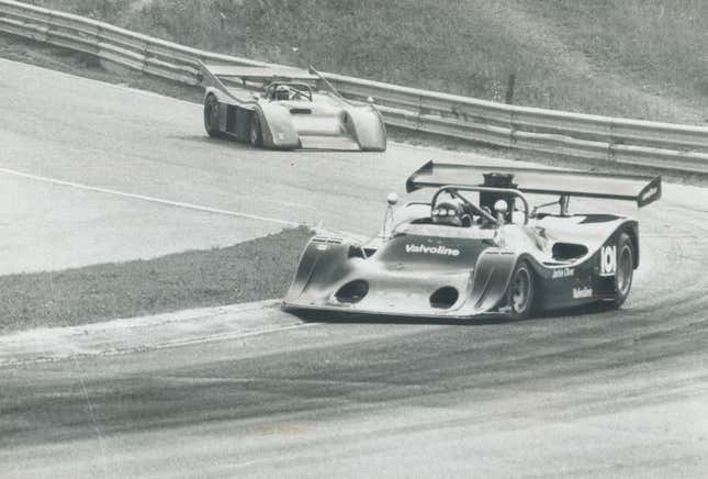 Headed back to museum: Jackie Oliver pilots his Shadow to victory yesterday in Player's 200 race at Mosport. George Follmer; shown trailing; was second. Below; Oliver gives victory sign as he holds trophy. Oliver and same car won race in 1974. Can-Am series was cancelled after that; but revived this year for sponsor's final year in auto racing. We'll just put it back in a museum; said Oliver