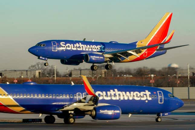 FILE - Southwest Airlines plane prepares to land at Midway International Airport, Feb. 12, 2023, in Chicago. Federal officials are investigating a reported engine fire that forced a Southwest Airlines plane to cancel takeoff and return to the gate at the Lubbock, Texas, airport on Thursday, April 4, 2024. (AP Photo/Kiichiro Sato, File)