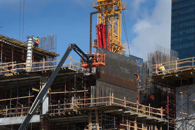 Construction workers help build a condo tower using steel on February 10, 2025 in Miami, Florida. U.S.