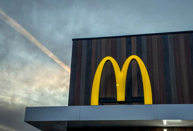 The sun sets at a McDonald’s in Wellington, England.