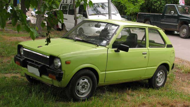 A photo of a green Suzuki Fronte hatchback. 