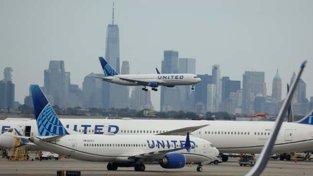 A United Airlines plane lands at Newark Liberty International Airport in front of the New York skyline on September 17, 2023 in Newark, New Jersey.