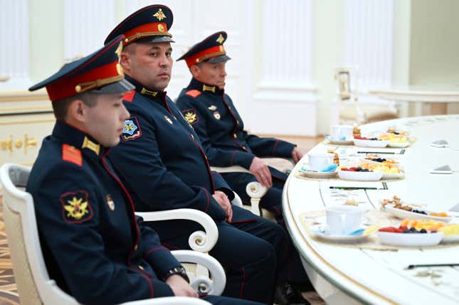 From left: Russian servicemen Cpl. Alexei Ivliev, awarded with the Order of Courage and Hero of the Russian Federation, Pvt. Ivan Kalashnikov and Pvt. Vyacheslav Tarasov, awarded with the Order of Courage, all of them participants of Russian special military operation, attend a meeting with Russian President Vladimir Putin at the Kremlin in Moscow, Russia, Friday, Sept. 29, 2023. (Pavel Bednyakov, Sputnik, Kremlin Pool Photo via AP)