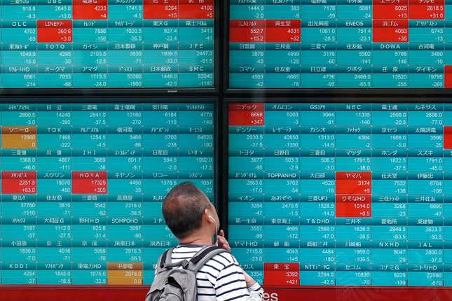 FILE - A person looks at an electronic stock board showing Japan&#39;s Nikkei 225 index at a securities firm Tuesday, April 16, 2024, in Tokyo. Asian shares advanced on Thursday even after sinking technology stocks sent Wall Street lower in the S&amp;P 500&#39;s worse losing streak since the start of the year. (AP Photo/Eugene Hoshiko, File)