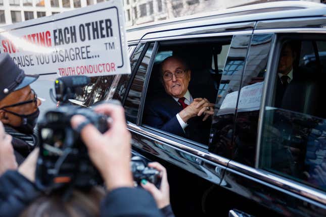 WASHINGTON, DC - DECEMBER 15: Rudy Giuliani, the former personal lawyer for former U.S. President Donald Trump, departs from the E. Barrett Prettyman U.S. District Courthouse after a verdict was reached in his defamation jury trial on December 15, 2023 in Washington, DC. A jury has ordered Giuliani to pay $148 million in damages to Fulton County election workers Ruby Freeman and Shaye Moss. (