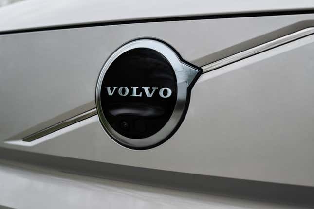 Front badge of a white Volvo EX90