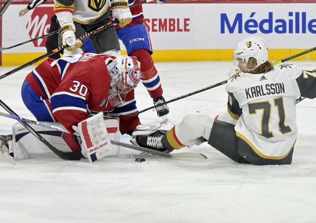 Nov 16, 2023; Montreal, Quebec, CAN; Montreal Canadiens goalie Cayden Primeau (30) stops Vegas Golden Knights forward William Karlsson (71) during the first period at the Bell Centre.