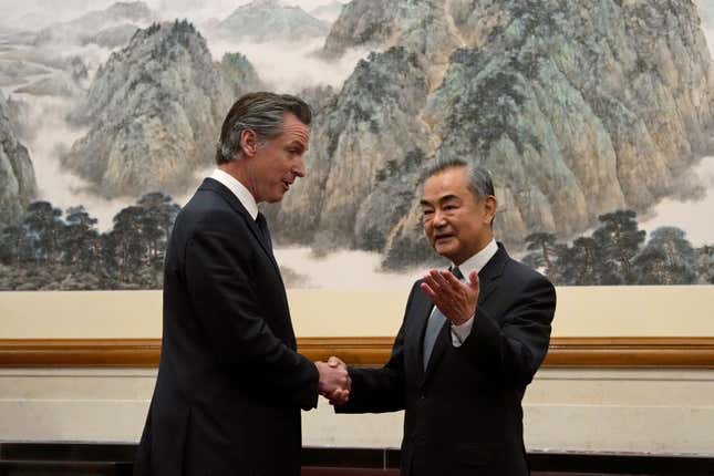 FILE - California Gov. Gavin Newsom, left, shakes hands with Chinese Foreign Minister Wang Yi during a meeting at the Diaoyutai State Guest House in Beijing, on Oct. 25, 2023. Gavin Newsom&#39;s trip to China, with the stated goal of working together to fight climate change, resulted in a surprise meeting with leader Xi Jinping and was filled with warm words and friendliness not seen in years in the China- U.S. relationship. (AP Photo/Ng Han Guan, File)