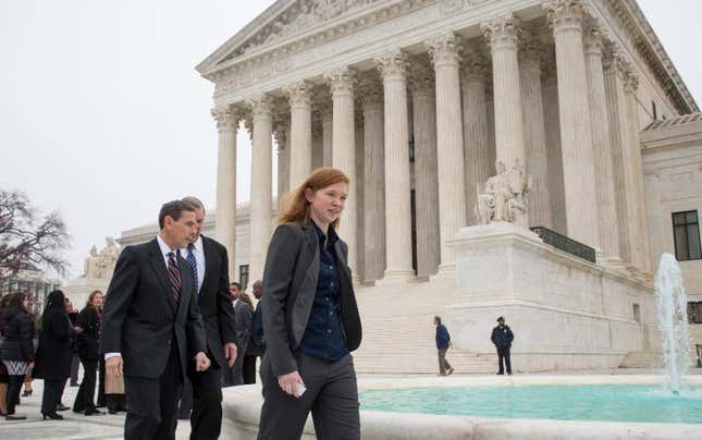 Abigail Fisher, who challenged the use of race in college admissions, walks with lawyers Edward Blum, left, and Bert Rein, rear, outside the Supreme Court in Washington, Wednesday, Dec. 9, 2015, following oral arguments in the Supreme Court in a case that could cut back on or even eliminate affirmative action in higher education. 