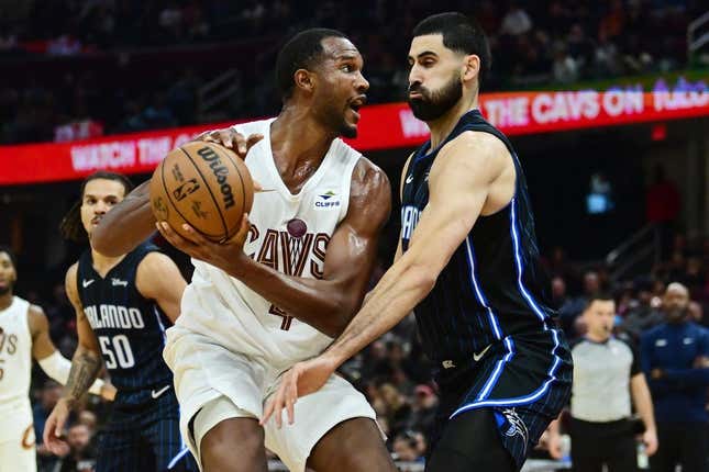 Oct 12, 2023; Cleveland, Ohio, USA; Cleveland Cavaliers forward Evan Mobley (4) drives to the basket against Orlando Magic center Goga Bitadze (35) during the second half at Rocket Mortgage FieldHouse.