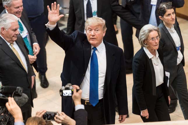 US president Donald Trump waves after arriving at the World Economic Forum in Davos, Switzerland.
