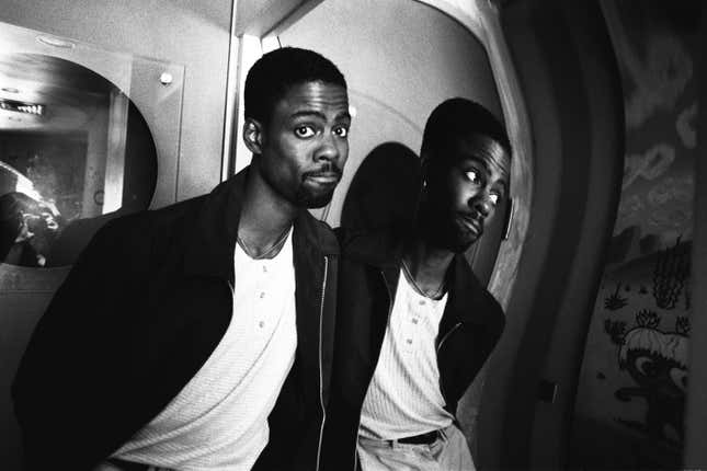 Chris Rock poses for a portrait in front of a fun house mirror in October 1997 in New York City, New York.