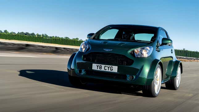 A photo of a green Aston Martin Cygnet city car. 