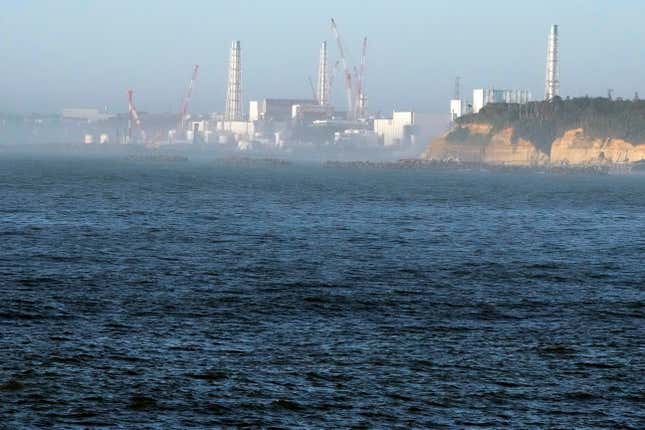 FILE - The Fukushima Daiichi nuclear power plant, damaged by a massive March 11, 2011, earthquake and tsunami, is seen from the nearby Ukedo fishing port in Namie town, northeastern Japan, on Aug. 24, 2023. The operator of the wrecked Fukushima Daiichi nuclear power plant said there is no safety worries or change to the plant’s decommissioning plans even though the deadly Jan. 1, 2024 earthquake in Japan’s north-central region caused some damages to a local idled nuclear plant, which rekindled safety concerns and prompted a regulatory body to order a close examination. (AP Photo/Eugene Hoshiko, File)