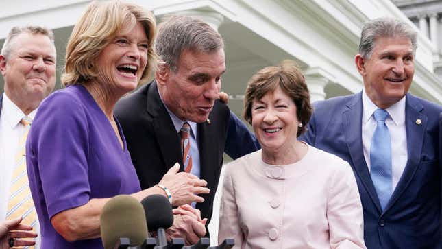 A bipartisan group of senators has a laugh after remarks by President Joe Biden, Thursday June 24, 2021, at the White House.