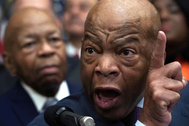 U.S. Rep. John Lewis (D-GA) (R) and Rep. Elijah Cummings (D-MD) (L) are two different people and were seen in the same room during a news conference at the U.S. Capitol January 4, 2019 in Washington, DC. 