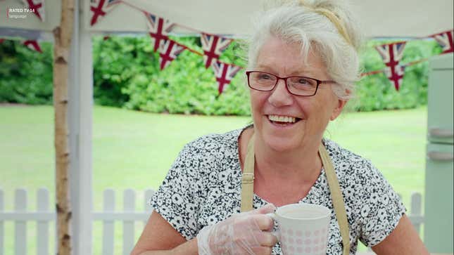 Contestant Linda drinking from a mug and smiling