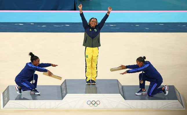 PARIS, FRANCE - AUGUST 05: Gold medalist Rebeca Andrade (C) of Team Brazil, silver medalist Simone Biles (L) of Team United States and bronze medalist Jordan Chiles (R) of Team United States celebrate on the podium at the Artistic Gymnastics Women’s Floor Exercise Medal Ceremony