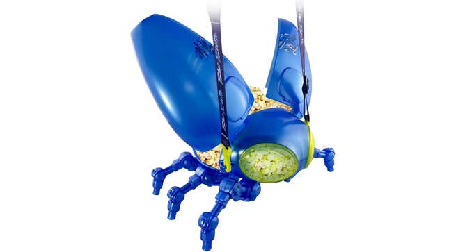 A blue, plastic, mechanical-looking blue beetle. Popcorn can be seen within through its clear eyes.