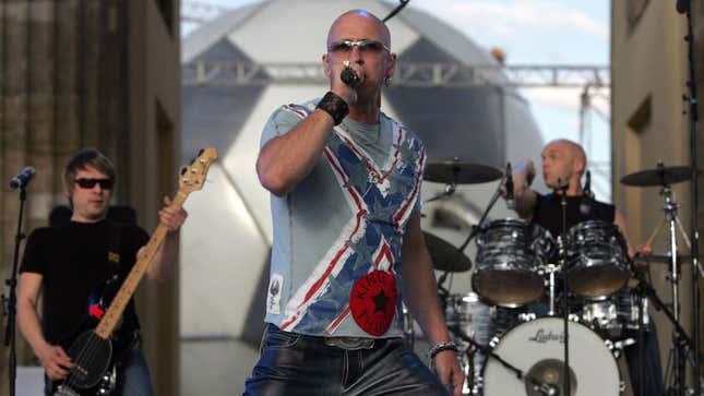 A photo of the band Right Said Fred performing live. 