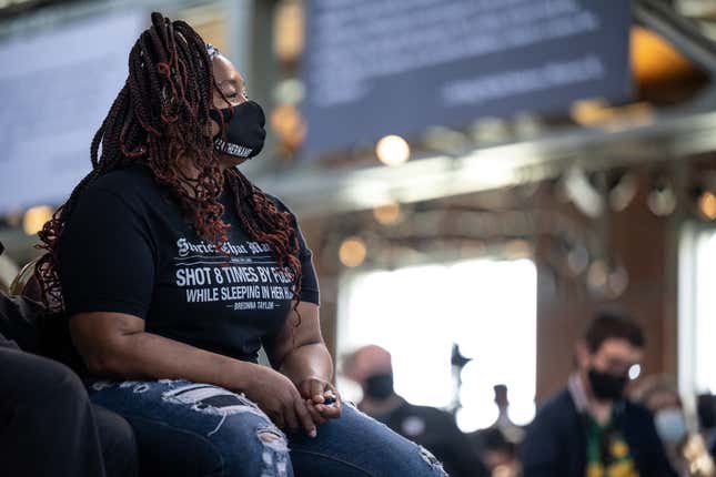 Tamika Palmer, Breonna Taylor’s mother, watches and listens as Kentucky Gov. Andy Beshear speaks at the Center for African American Heritage during a bill signing event on April 9, 2021, in Louisville, Kentucky. 