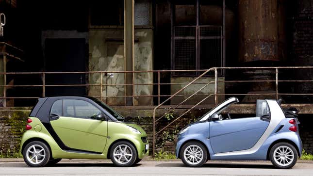 A photo of two Smart ForTwo city cars. 