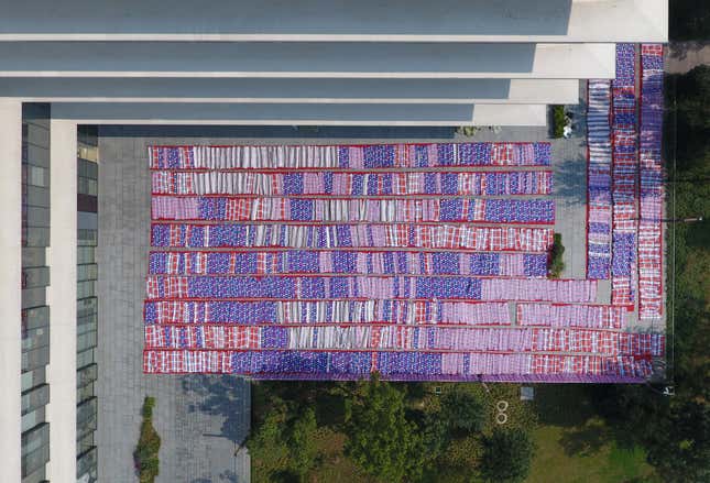 Quilts for Alibaba Group's employees to rest as they prepare for the upcoming 11.11 global shopping festival, also called Singles' Day shopping festival, are dried in a yard of Xixi campus of Alibaba Group in Hangzhou, Zhejiang Province, China November 3, 2016.