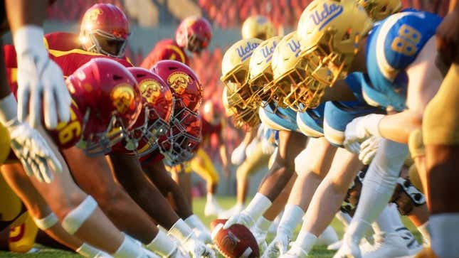 College football players line up for a play. 