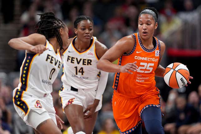 First-time Olympian Alyssa Thomas of the Connecticut Sun drives against Kelsey Mitchell and Temi Fagbenle of the Indiana Fever.