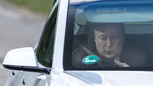 Tesla CEO Elon Musk sits in a car arriving to the construction site for a new Tesla in Gruenheide near Berlin, northeastern Germany on May 17, 2021.