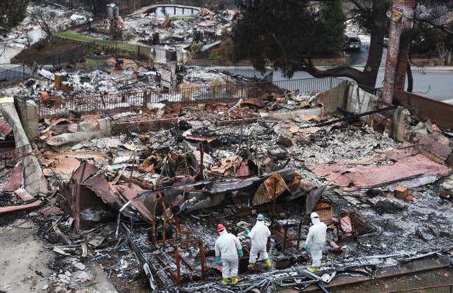 Environmental Protection Agency (EPA) contractors work to remove hazardous waste from a home destroyed in the Eaton Fire on February 12, 2025 in Altadena, California. A powerful atmospheric river storm is expected to impact Southern California with growing concerns of rock slides and mudslides in recent burn scar areas including hillside areas impacted by the Palisades and Eaton fires.