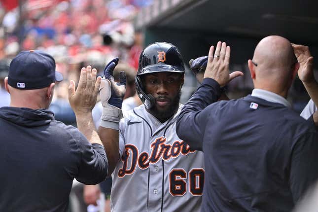 May 6, 2023; St. Louis, Missouri, USA;  Detroit Tigers left fielder Akil Baddoo (60) is congratulated by teammates after scoring against the St. Louis Cardinals during the fifth inning at Busch Stadium.