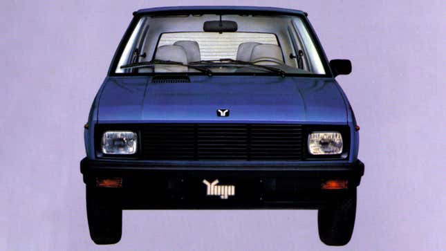 A photo of a dark blue Yugo hatchback. 