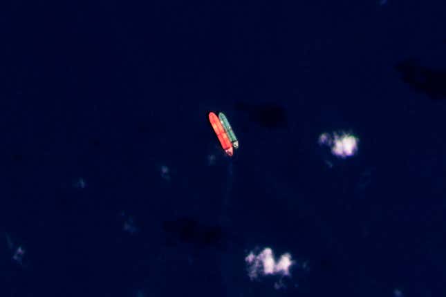 FILE - In this satellite photo provided by Planet Labs PBC, vessels identified as the Virgo, left, and the Suez Rajan, by the advocacy group United Against Nuclear Iran, are seen in the South China Sea on Feb. 13, 2022. A Greek shipper has pleaded guilty to a charge over it smuggling sanctioned Iranian crude oil and agreed to pay a $2.4 million fine, U.S. federal court papers seen Thursday, Sept. 7, 2023 by The Associated Press show. (Planet Labs PBC via AP, File)