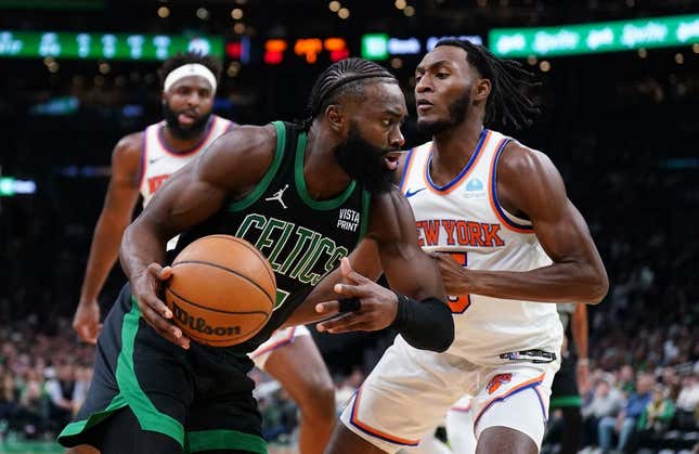 Nov 13, 2023; Boston, Massachusetts, USA; Boston Celtics guard Jaylen Brown (7) drives the ball against New York Knicks guard Immanuel Quickley (5) in the first quarter at TD Garden.