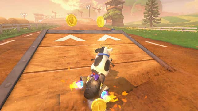 A cow on a motorcycle speeds toward a coin.