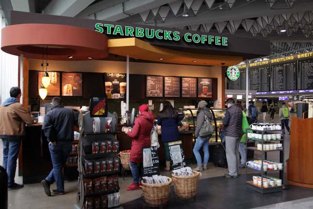 Passengers waiting at a Starbucks at Frankfurt Airport.
