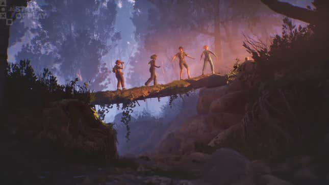 Four teens walk across a fallen tree trunk in a forest.