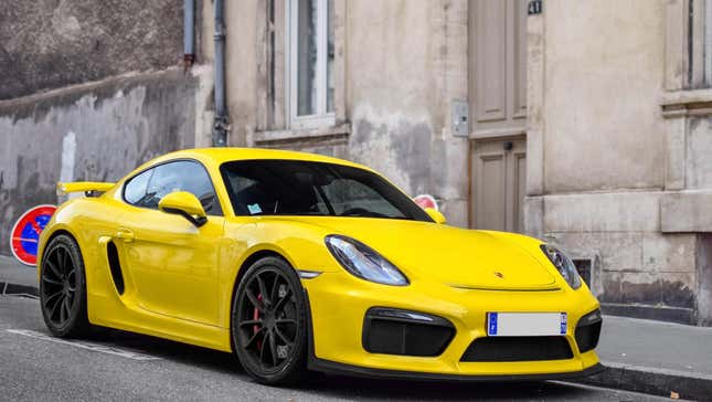 A yellow Porsche Cayman GT4