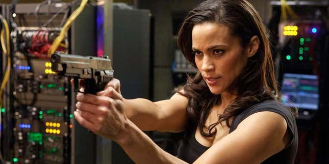 Paula Patton pointing a gun
