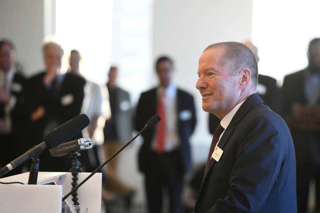 This 2019 photo shows Shai Reshef, president and founder of University of the People, speaking at a graduation ceremony in New York. Reshef and Arizona State professor and researcher Michelene Chi, who has developed a framework to improve how students learn, are the 2023 winners of The Yidan Prize, the biggest award in education. (Courtesy of University of the People via AP)