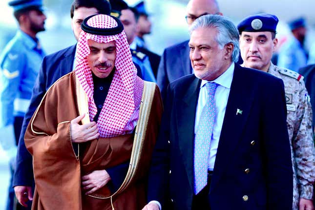 In this photo released by Ministry of Foreign Affairs, Pakistani&#39;s Foreign Minister Ishaq Dar, right, greets his Saudi counterpart Prince Faisal bin Farhan upon his arrival at a military airbase in Rawalpindi, Pakistan, Monday, April 15, 2024. Saudi Arabia&#39;s foreign minister led a high-level delegation on a two-day visit to Pakistan, which is seeking help in overcoming one of its worst economic crises. (Ministry of Foreign Affairs via AP)