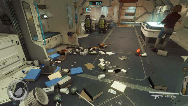 A bunch of garbage litters the floor of a spaceship.