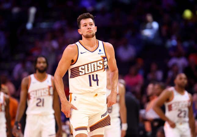 Oct 10, 2023; Phoenix, Arizona, USA; Phoenix Suns forward Drew Eubanks (14) against the Denver Nuggets during a preseason game at Footprint Center.