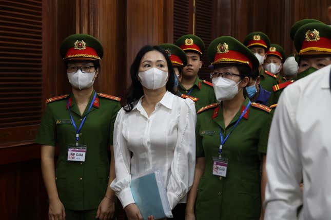 FILE - Vietnamese real estate tycoon Truong My Lan, front center, is escorted into a courtroom in Ho Chi Minh city, Vietnam, on March 5, 2024. Truong My Lan is facing a possible death penalty for allegedly embezzling $12.5 billion. Lan&#39;s trial began earlier this month in Ho Chi Minh City. (Phan Thanh Vu/VNA via AP, File)