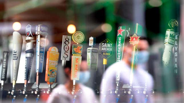 A photo of beer taps in a bar. 