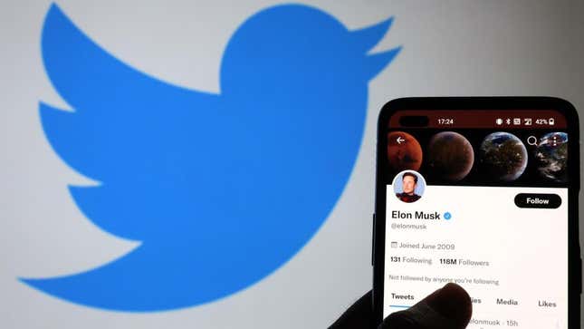 A phone screen shows Elon Musk's Twitter.