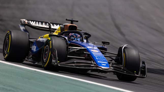 A photo of a Williams F1 car racing on track. 